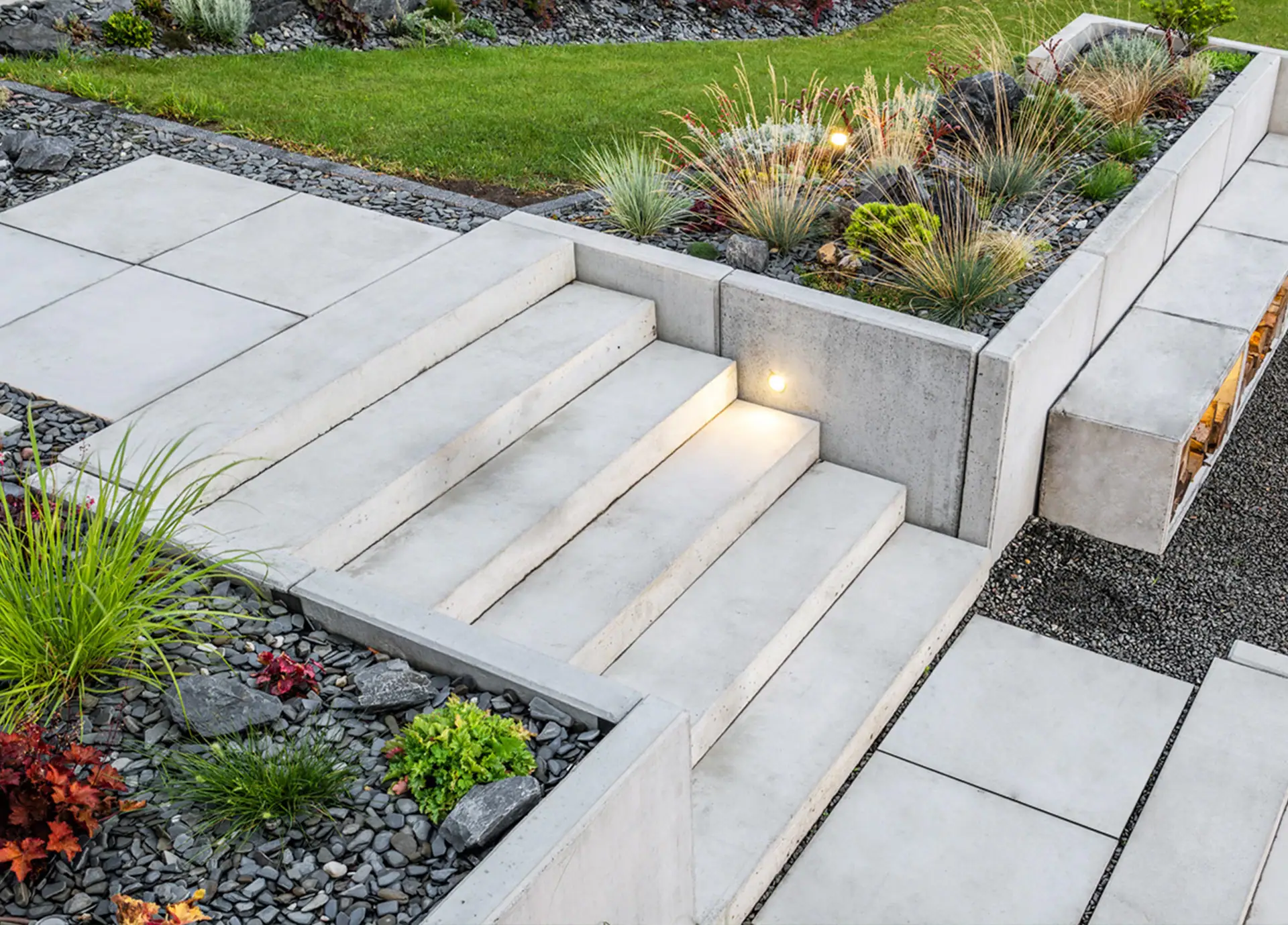 Modern urban garden with concrete steps and integrated lighting, Surrey.