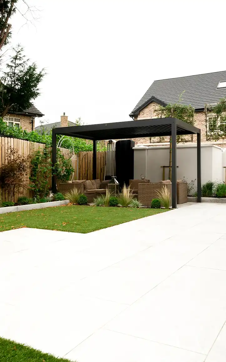 Modern family garden design Epsom featuring porcelain patio and lawn layout