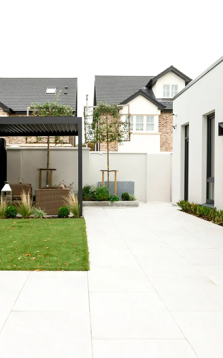 Low maintenance family garden with pergola seating and structured layout